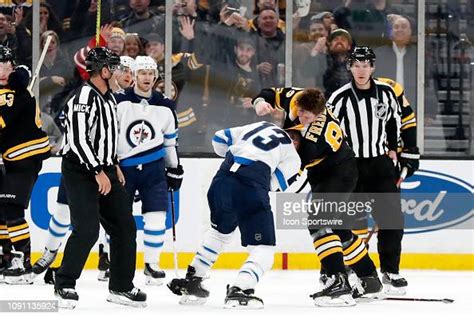 Boston Bruins center Trent Frederic fights Winnipeg Jets right wing... News Photo - Getty Images