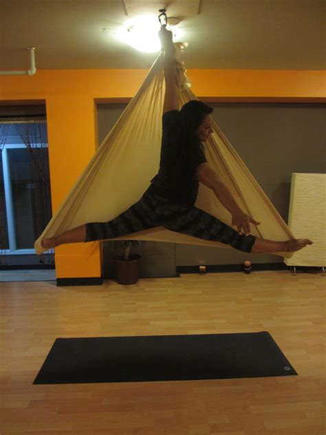 Supported by beautiful silks, aerial yoga helps increase strength ...