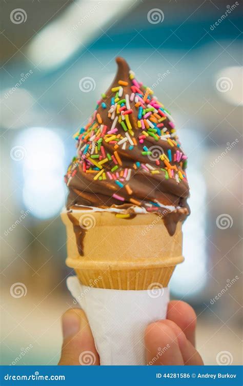 Ice Cream Cone with Chocolate and Rainbow Color Sprinkles on Blu Stock Photo - Image of color ...