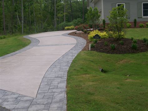 Concrete Stamped Border Driveway With Broom Finish Interior.