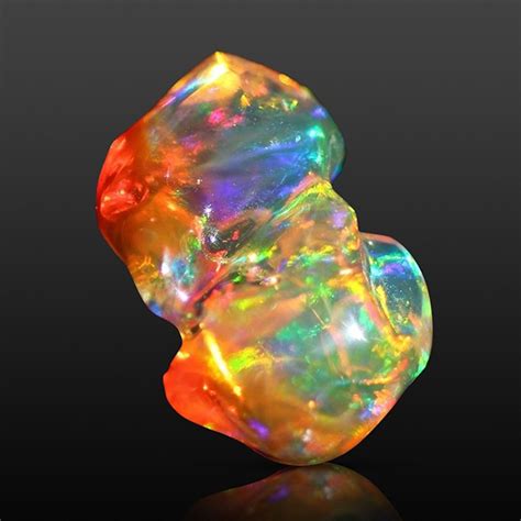 GIA on Instagram: “This fire opal is on fire! Fire opals are known for their brown, yellow ...