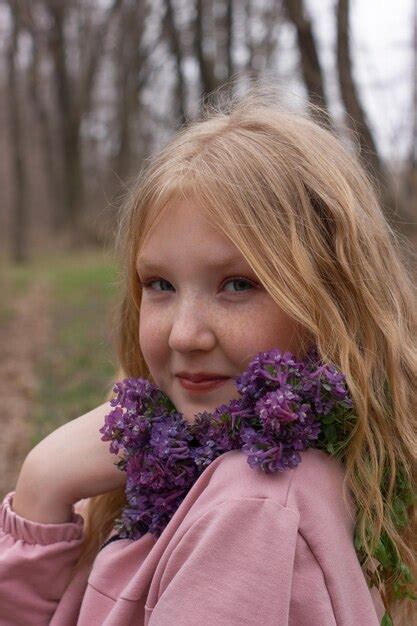 Premium Photo | Girl with flowers is smiling