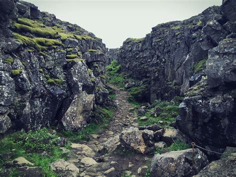 A rift in Þingvellir Park in Iceland where a divergent boundary is ...