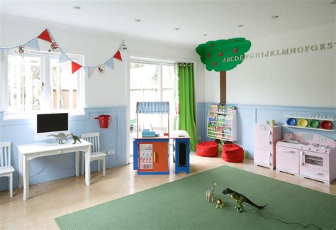 apple tree mural and bunting clad child’s playroom in white and baby ...