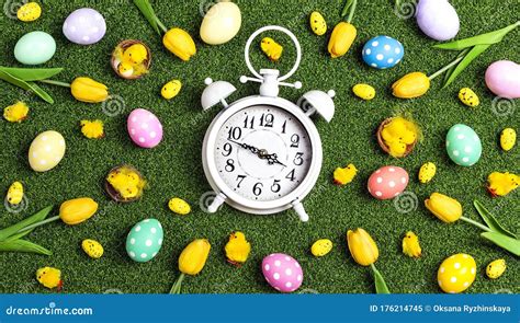 Easter Alarm Clock with Colorful Eggs and Tulips on a Green Grass Background Stock Image - Image ...