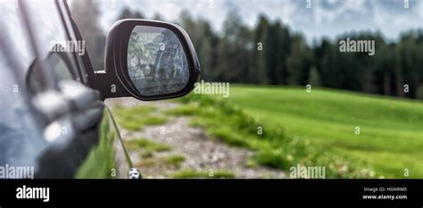 car for traveling with a mountain road Stock Photo - Alamy