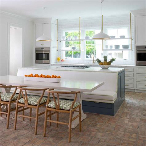 Agnes Large Pendant hanging above a kitchen island with a dining ben… | Kitchen island dining ...