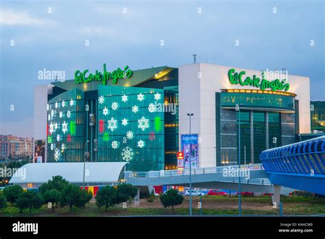 Facade of El Corte Ingles shopping center at Christmas, night view. Sanchinarro, Madrid, Spain ...