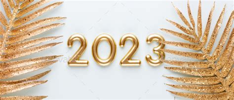 Happy New Year 2023 poster. Christmas background with gold 2023 numbers. Stock Photo by GitaKulinica