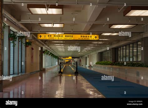 Restaurant, duty free shop, transfer counter signage; empty corridor ...