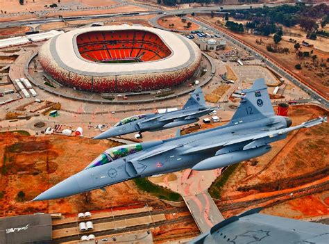 The South African Air Force Saab JAS 39 Gripen’s flying over the FNB Stadium in Johannesburg ...