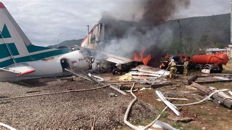 Two killed after Russian plane overshoots runway and bursts into flames ...