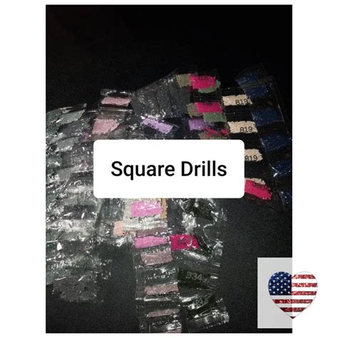 there is a pile of square drills next to an american flag with the words square drills on it