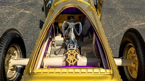 This coffin has been transformed into a four-wheeled V8 Dragula replica ...