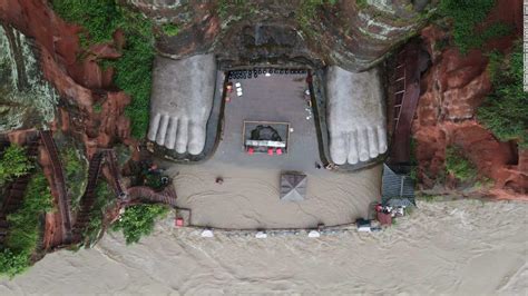 China flooding: Waters reach the toes of famous Leshan giant Buddha ...