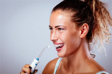 Dental Implants Aftercare: Is a Water Flosser the Right Tool? - Alicia Dental