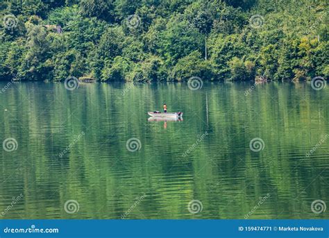 Zvornik, Bosnia and Herzegovina - July 31, 2019. Man Fishing on the Boat on Lake Zvornik on the ...