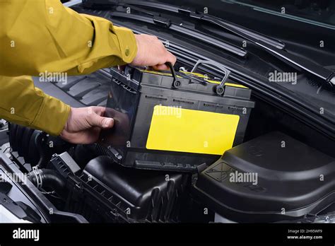 Vehicle battery installation Stock Photo - Alamy