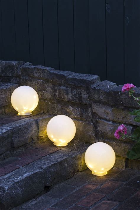 Easy DIY Outdoor Globe Lights - Room for Tuesday | Outdoor globe lights, Outdoor party lighting ...