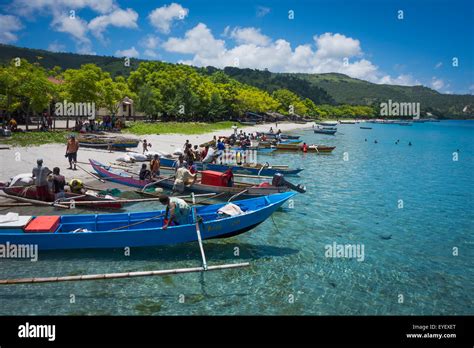 Boats lined up along the shore of Atauro Island beach; Atauro Island, Timor-Leste Stock Photo ...