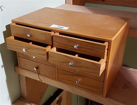 SMALL OAK 8 DRAWER COUNTER TOP CABINET