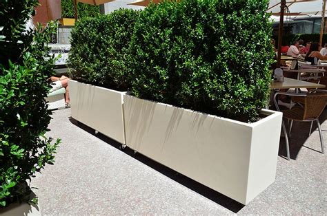 Movable fiberglass planters on casters at Rockerfeller Center by DeepStream Designs | Large diy ...