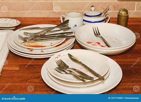 Dirty Dishes and Cutlery on a Fitted Kitchen Stock Image - Image of ...