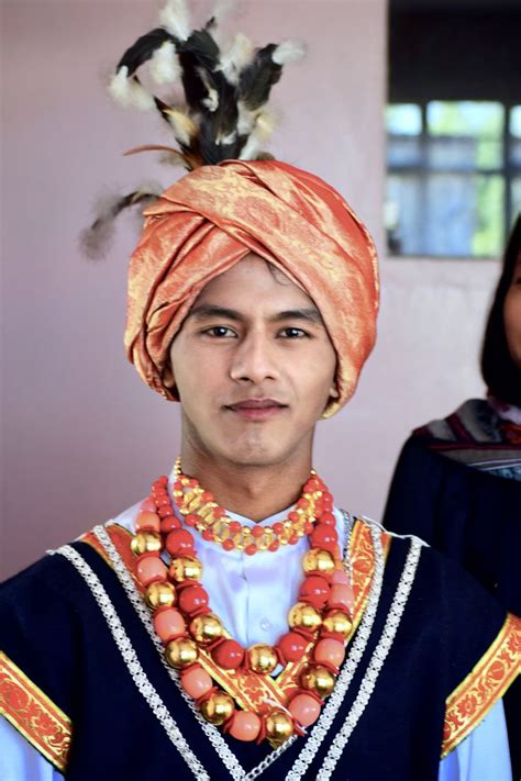 Marbudiaki Wankhar in traditional Khasi dress wearing Golden Jainspong (turban), Black Jymphong ...