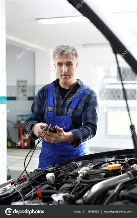 Car electrician. Electromechanics. Stock Photo by ©robertprzybysz 136885352