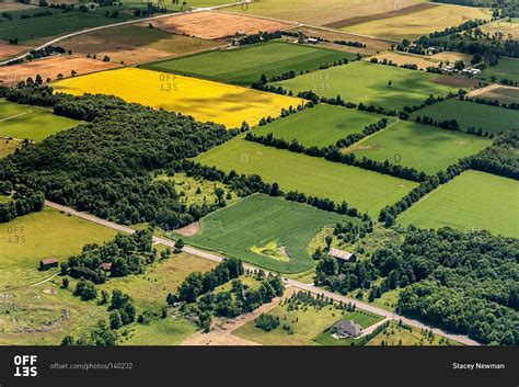 An aerial view of rectangular tracts of farmland stock photo - OFFSET