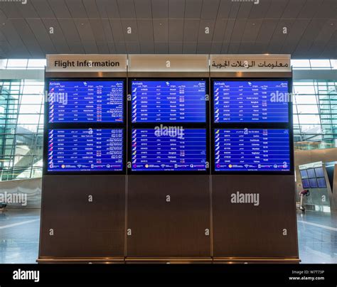 Arrivals flight information board in Hamad International Airport, Doha ...