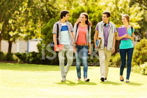 College Students Walking On Campus Lawn Stock Photo | Royalty-Free ...