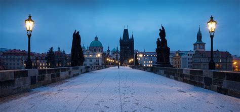 charles-bridge-snow-winter-dawn-destination-landmark-prague-czech-republic