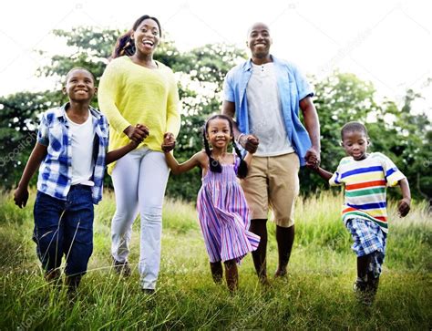 Happy African family in the park — Stock Photo © Rawpixel #71682351