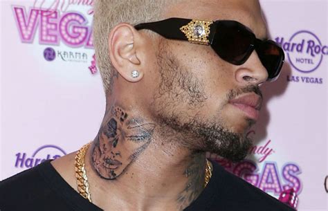 Chris Brown’s New Tattoo Shockingly Resembles A Battered Rihanna