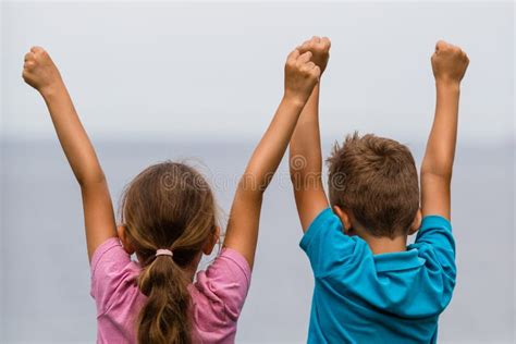 Kids with raised arms stock image. Image of fist, arms - 43807883