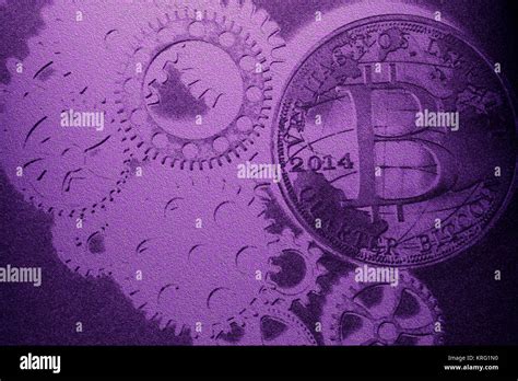 Metal gear wheels with bitcoin Stock Photo - Alamy