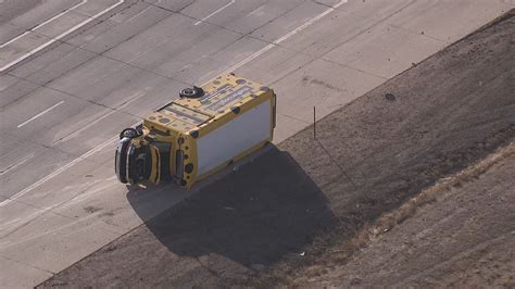 PHOTOS: Parking shuttle rolls over near DIA | 9news.com