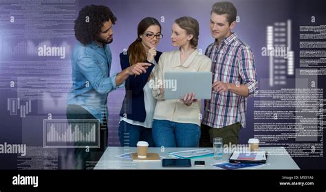 Group of people working on laptop with screen text interface Stock Photo - Alamy