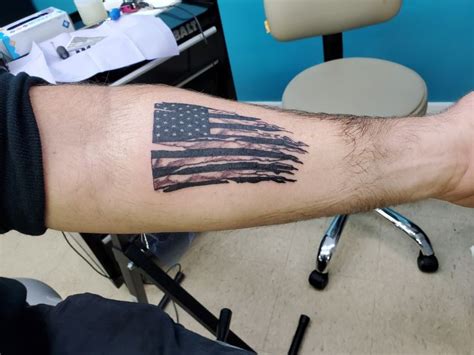 American flag. Tattoo. | Flag tattoo, Hand tattoos for guys, American flag tattoo