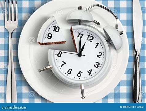 Time To Meal Concept, Cut Clock on Plate. Top View Stock Photo - Image ...