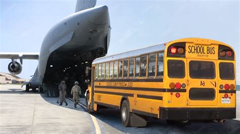 Loading Massive School Buses Inside US C-17 Globemaster III - YouTube