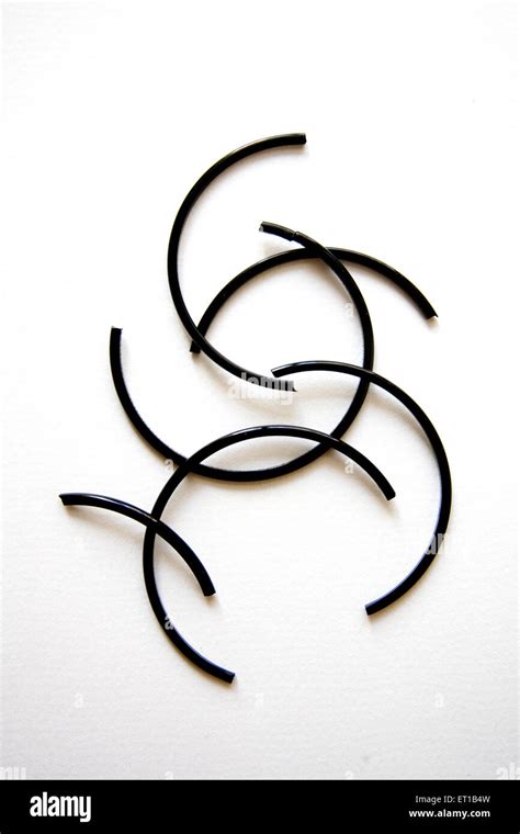 Broken black color glass bangles on white background Stock Photo - Alamy