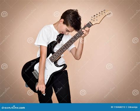 Young Boy Playing Electric Guitar Stock Photo - Image of caucasian, concert: 118468212