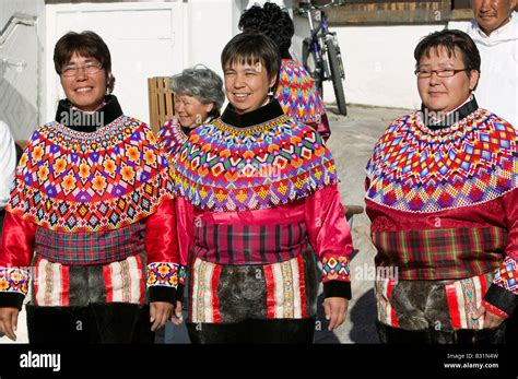 Inuit women wearing traditional Greenlandic national costume or Kalaallisuut in Ilulissat on ...