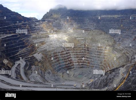 Caterpillar 797B Overburden trucks at the Grasberg Mine in Papua, Indonesia, 2018. At 4500m ...