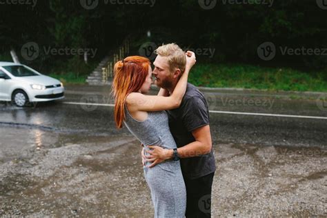 beautiful couple hugging in the rain 11371053 Stock Photo at Vecteezy