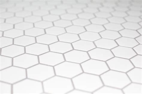 White hexagon bathroom floor tile with grey grout. | Tile floor, Trendy ...