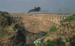 Construction of the Victoria Falls Bridge and the railway line are ...