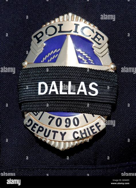 Dallas, Texas, USA. 12th July, 2016. A police officer's badge is shown ...